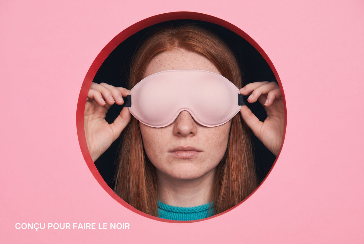 Woman wearing the AerPack 3D Sleep Mask in Pink: designed for darkness