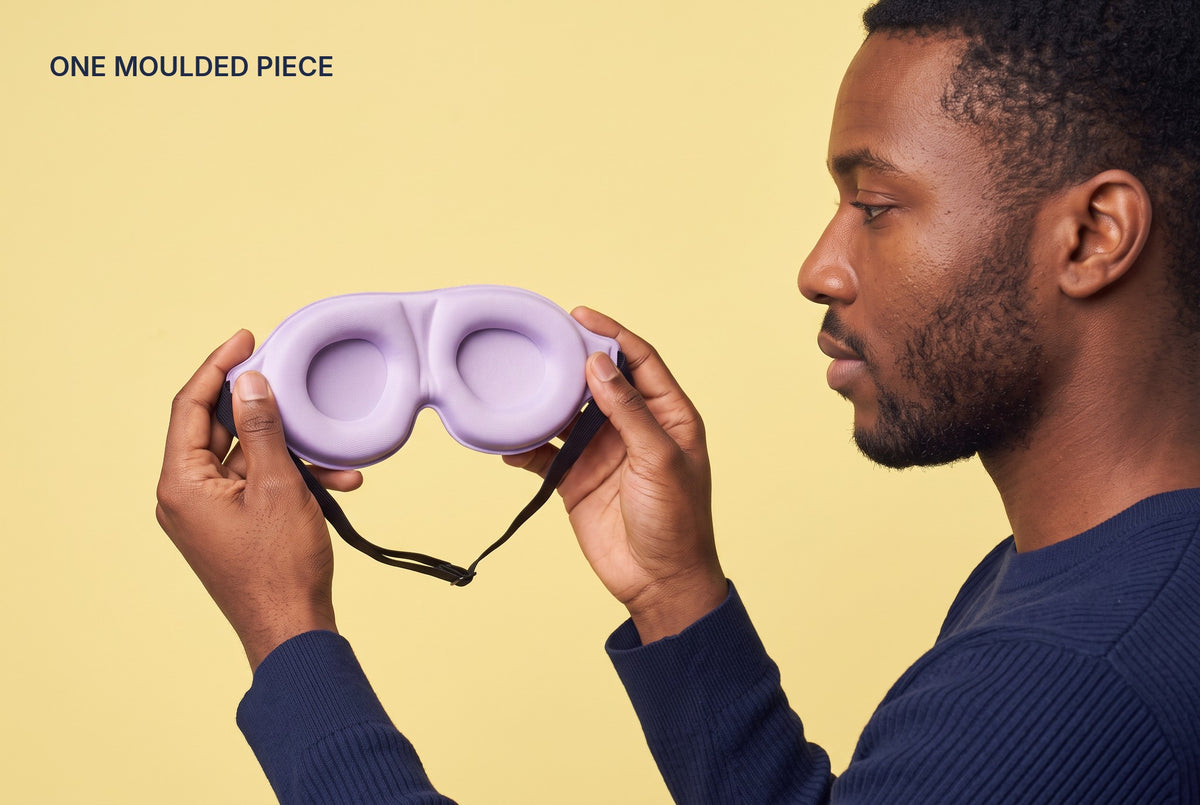 Man holding the AerPack 3D Sleep Mask in Purple: one moulded piece